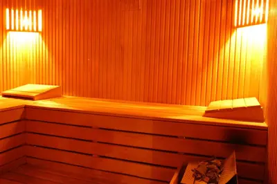 a wooden sauna with two lights on top of it at Sidonya Hotel in Istanbul