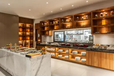 a restaurant with a buffet of food on display at Hyatt House Gebze in Gebze