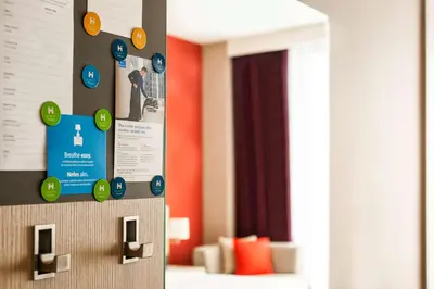 a wall with a bunch of stickers on it at Hyatt House Gebze in Gebze