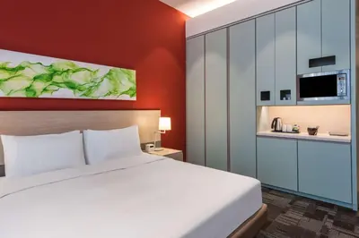 a hotel room with a bed and a kitchen at Hyatt House Gebze in Gebze