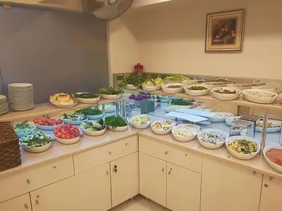 a buffet with many bowls of food on display at Hotel Süreyya in Istanbul