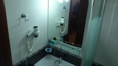 a bathroom with a sink and a mirror at Basileus Hotel in Istanbul