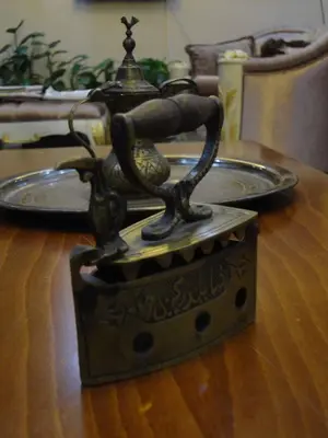 a bronze statue of a woman on a table at Basileus Hotel in Istanbul