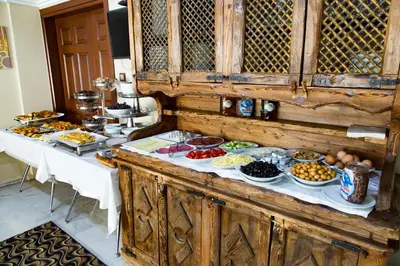 a buffet with many plates of food on a table at My Kent Hotel in Istanbul