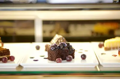 a plate with a piece of chocolate cake and blueberries at Hotel Momento Golden Horn in Istanbul