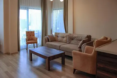 a living room with a couch and a coffee table at Sawsana Villalari in Sapanca
