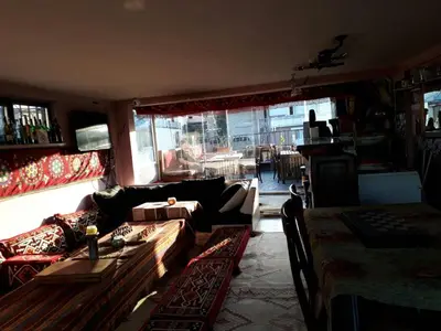 a living room with a couch and a table at Istanbul Harmony Hostel in Istanbul