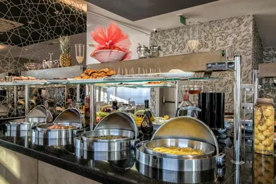 a kitchen with many pots of food on a counter at AHC Grand Bazaar Hotel in Istanbul