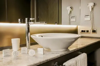 a bathroom with a large white bowl on a counter at AHC Grand Bazaar Hotel in Istanbul