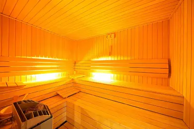 a large wooden sauna with a bench in it at Antea Palace Hotel & Spa in Istanbul