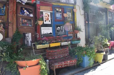 a building with pictures and a bench in front of it at Sur Istanbul Hotel in Istanbul