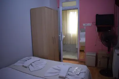 a bedroom with a bed with towels on it at Sur Istanbul Hotel in Istanbul