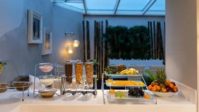 a table with a variety of fruits and vegetables on it at Biz Cevahir Hotel Sultanahmet in Istanbul