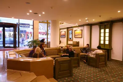 a group of people sitting in a lobby at Istanbul Royal Hotel in Istanbul