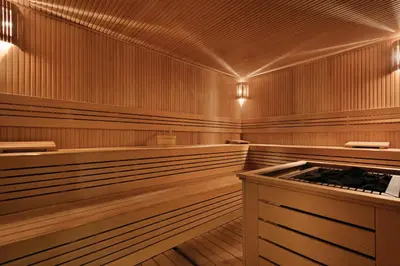 an empty sauna with wood paneling and a wooden floor at TRYP by Wyndham Istanbul Basın Ekspres in Istanbul