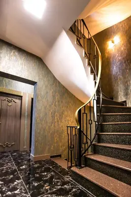 a spiral staircase in a building with a door at Dara Old City Hotel in Istanbul