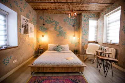 a bedroom with a bed and a table and chairs at Flats Company -Mujgan Apartment in Istanbul