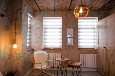 a room with two chairs and two windows at Flats Company -Mujgan Apartment in Istanbul