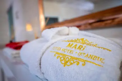 a pile of white towels with a sign on it at Mari Suites Hotel in Istanbul