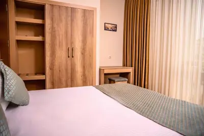a hotel room with a bed and a closet at Mari Suites Hotel in Istanbul