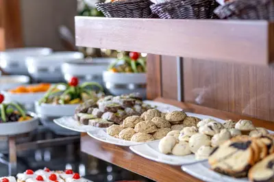 a buffet with plates of food on a table at Hotel Momento - Special Category in Istanbul