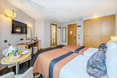 a hotel room with a large bed and a bathroom at Hotel Momento - Special Category in Istanbul