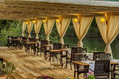 a row of tables and chairs in a restaurant at Agva Greenline Guesthouse (Adult Only +12) in Agva