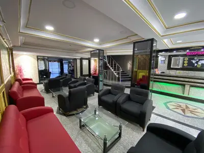 a waiting room with red chairs and a pool at Grand Oral Hotel in Istanbul