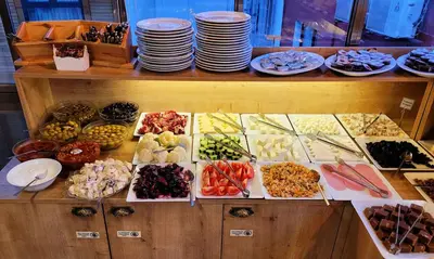 a buffet filled with lots of different types of food at Marmara Guesthouse in Istanbul