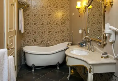 a bathroom with a tub and a sink at Limak Yalova Thermal Boutique Hotel in Gokcedere