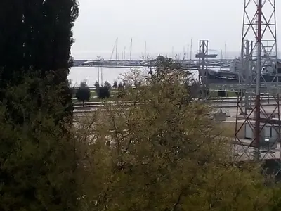 a view of a marina with a bridge in the background at Pendik Marine Hotel in Istanbul