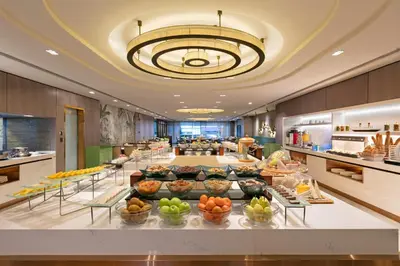a buffet line with fruit on display in a restaurant at Titanic Port Bakirkoy in Istanbul
