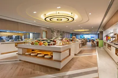 a buffet line in a restaurant with food on display at Titanic Port Bakirkoy in Istanbul