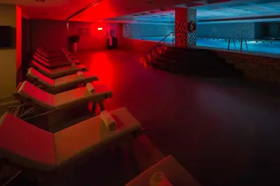 a room with red lights and chairs in a gym at Titanic Port Bakirkoy in Istanbul