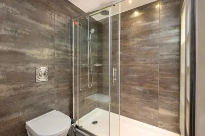a bathroom with a shower and a toilet at Limak Eurasia Luxury Hotel in Istanbul