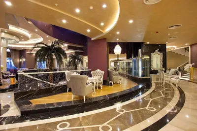 a lobby of a hotel with chairs and a bar at Limak Eurasia Luxury Hotel in Istanbul