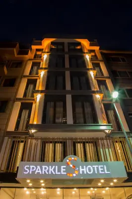 a building with a hotel sign in front of it at Sparkle Hotel in Istanbul
