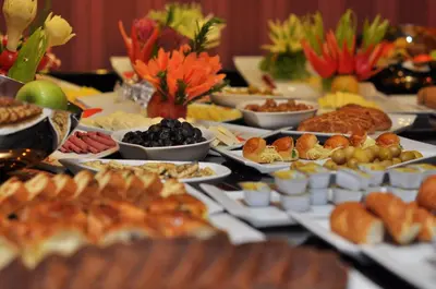 a table filled with appetizers and food on plates at Hotel Perula & SPA in Istanbul