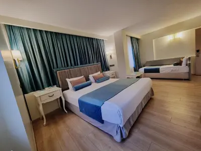 a hotel room with a large bed in a room at Taximtown Hotel in Istanbul