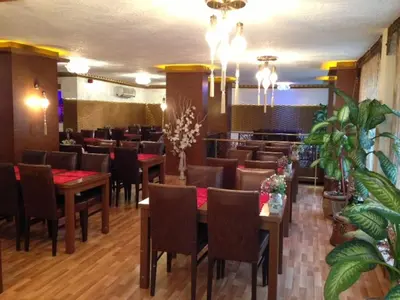 a restaurant with tables and chairs in a room at Maya Hotel in Istanbul