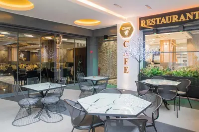 a restaurant with tables and chairs in front of a store at Classy Suite Taksim in Istanbul
