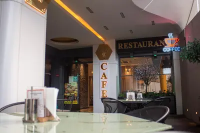 a restaurant with a glass table and chairs in front of it at Classy Suite Taksim in Istanbul