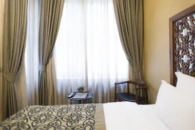 a hotel room with a bed and a window at Taksim Prelude Hotel in Istanbul