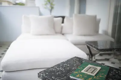 a room with a bed and a table with a book at The Story Hotel Pera in Istanbul