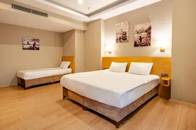 a bedroom with two beds in a room at Beyoglu MLS Hotel in Istanbul