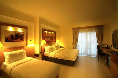 a hotel room with two beds and a desk at Beyoglu MLS Hotel in Istanbul
