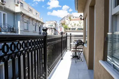 a balcony with a black fence and a table at Meroddi Pera Flats in Istanbul