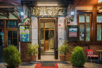 a door to a restaurant with plants in front of it at Yeni Hotel in Istanbul
