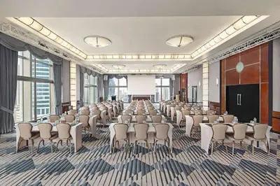 a conference room with rows of chairs and a podium at Hyatt Centric Levent Istanbul in Istanbul