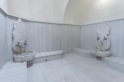 a white bathroom with a sink and a toilet at Boyuguzel Termal Hotel in Bursa